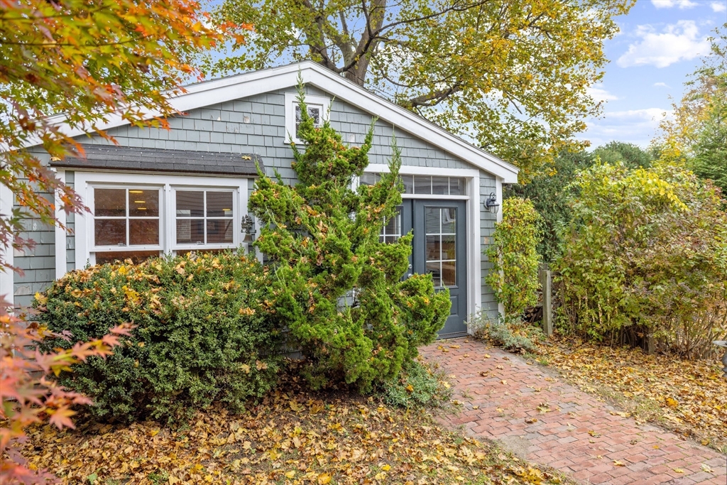25 Curtis Street Marblehead, MA 01945 - Photo 26 of 28 a front view of house with yard and trees around