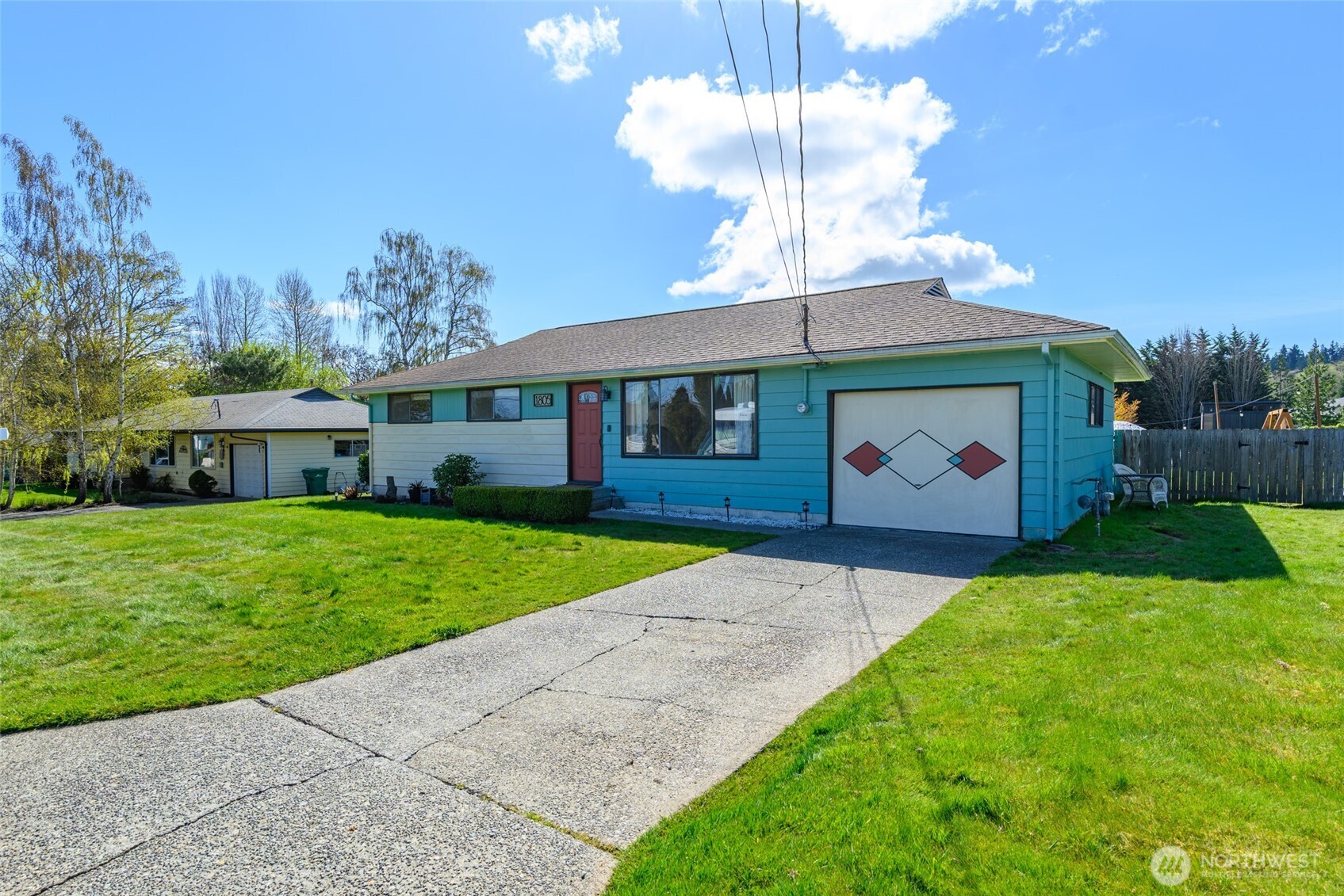 a front view of house with yard and outdoor seating