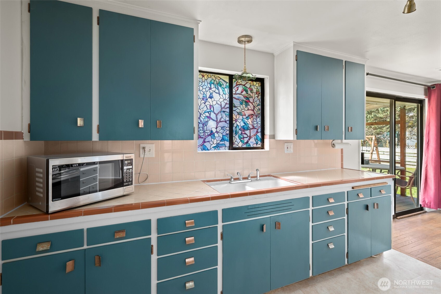 1805 37th Street Anacortes, WA 98221 - Photo 14 of 40 a kitchen with a sink and a microwave