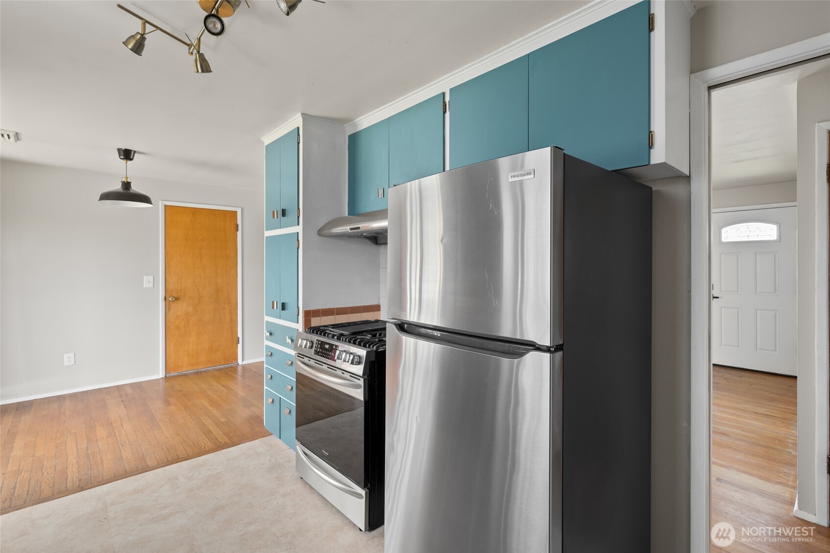 1805 37th Street Anacortes, WA 98221 - Photo 16 of 40 a white refrigerator freezer and a stove sitting inside of a kitchen