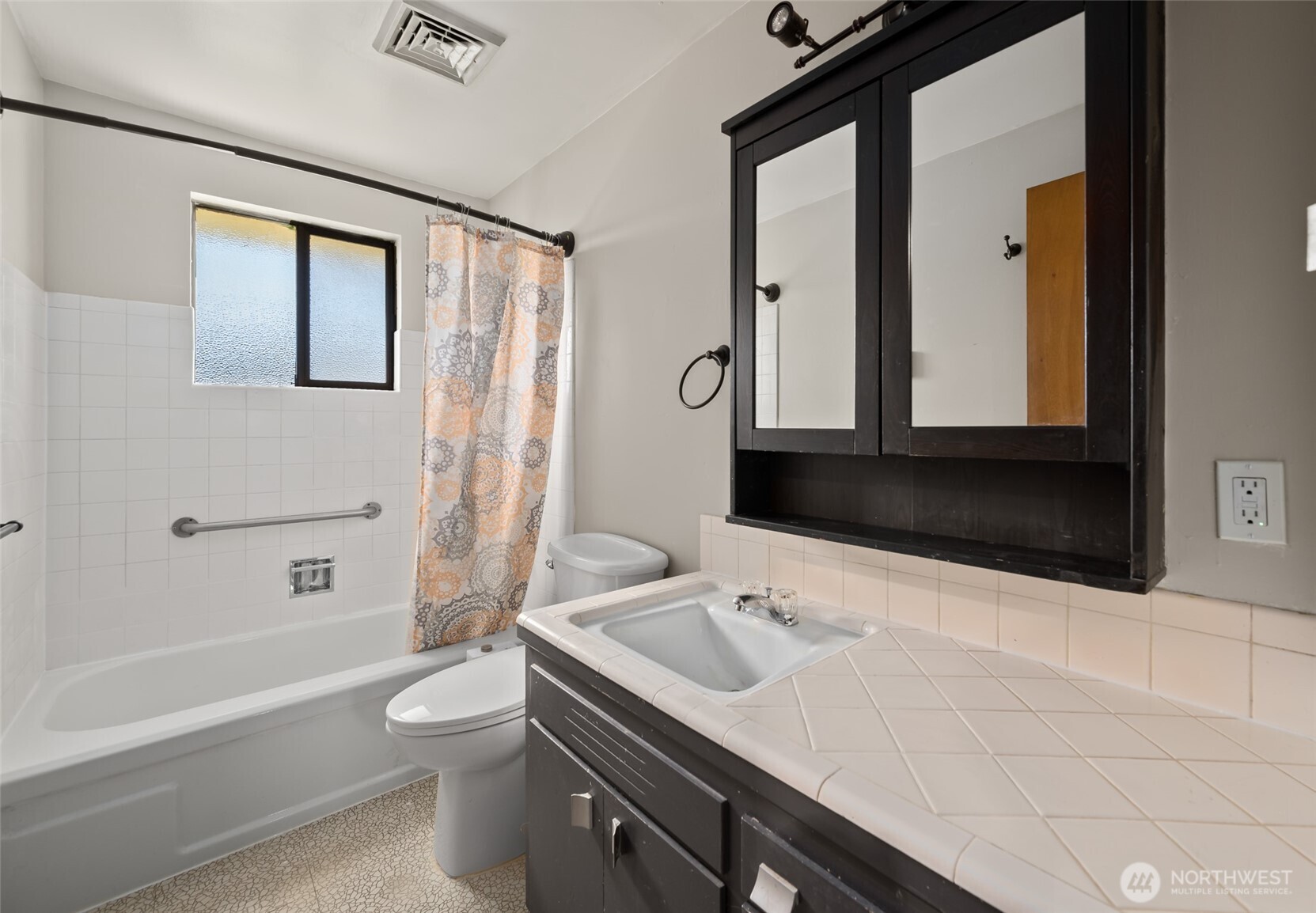 1805 37th Street Anacortes, WA 98221 - Photo 17 of 40 a bathroom with a sink a toilet and shower