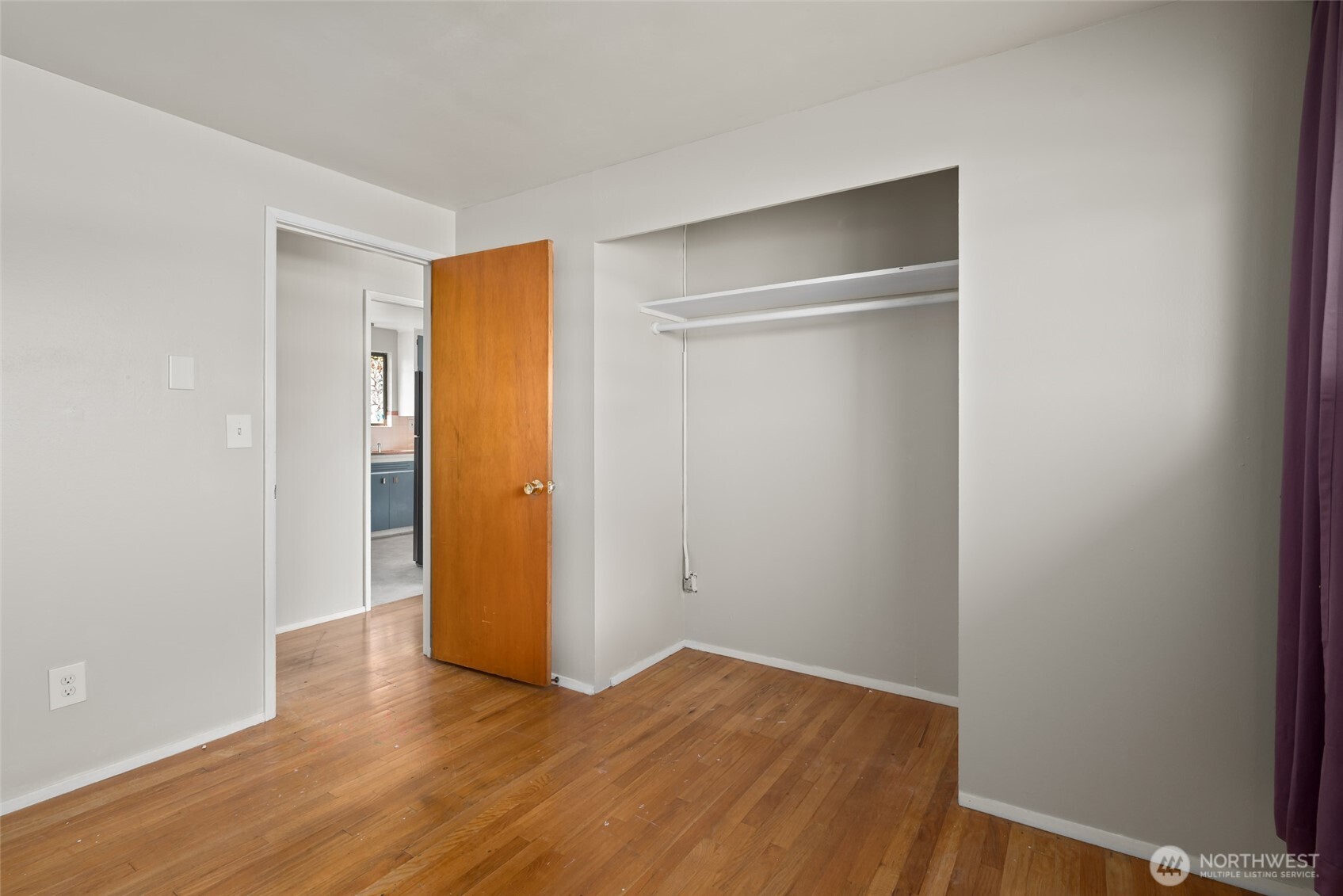 1805 37th Street Anacortes, WA 98221 - Photo 19 of 40 a view of an empty room with wooden floor and closet