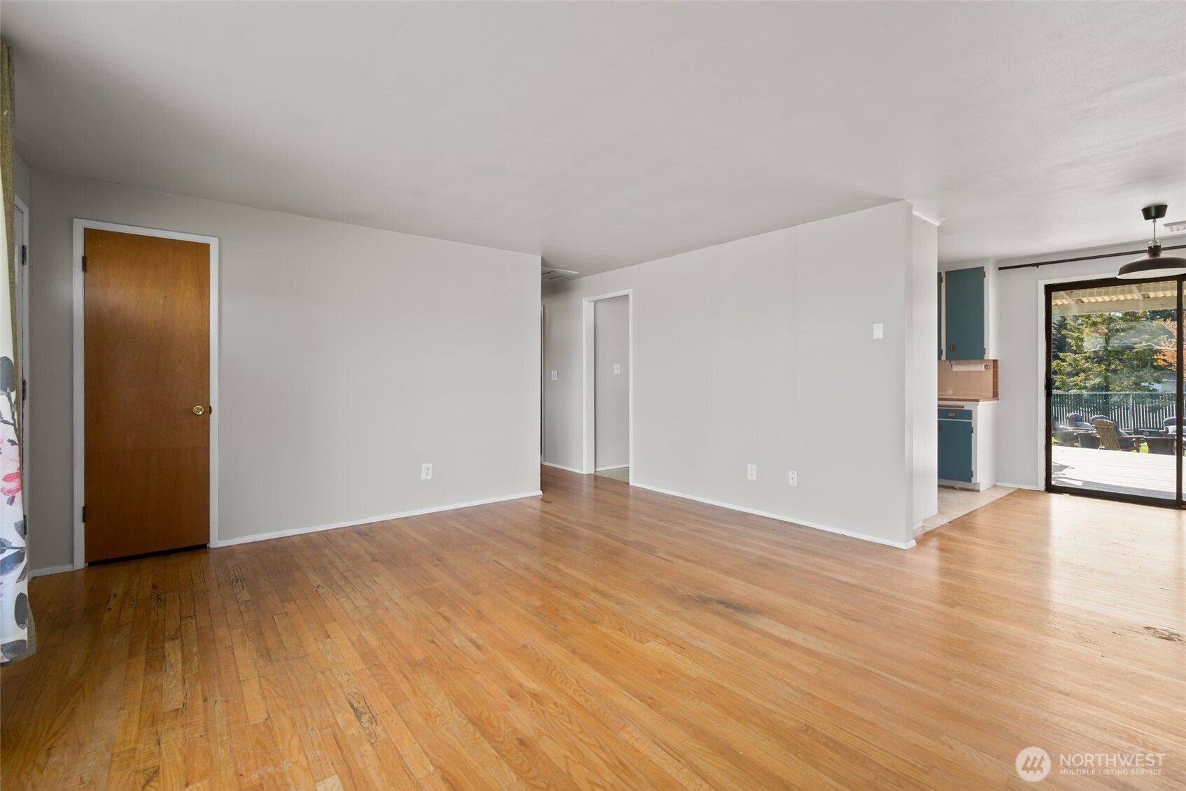 1805 37th Street Anacortes, WA 98221 - Photo 22 of 40 a view of an empty room with wooden floor and a window
