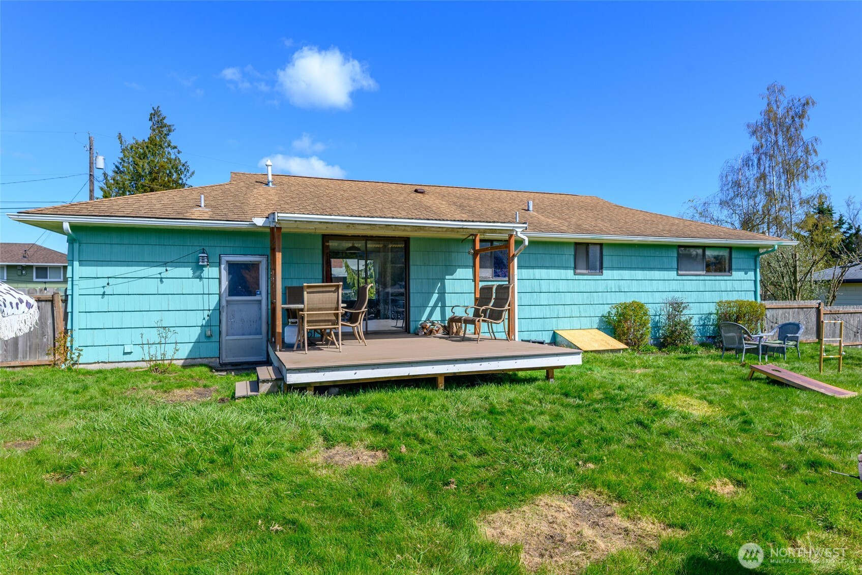 1805 37th Street Anacortes, WA 98221 - Photo 25 of 40 a view of a house with a yard porch and sitting area
