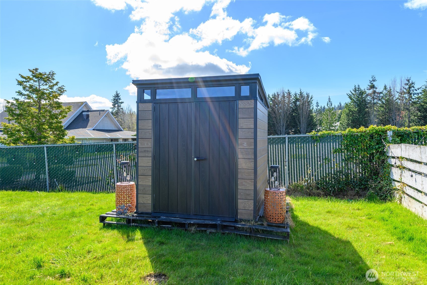 1805 37th Street Anacortes, WA 98221 - Photo 26 of 40 a view of a backyard with a garden