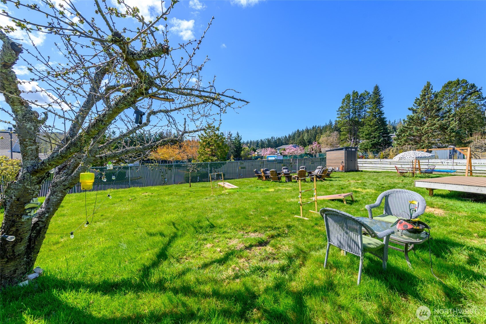 1805 37th Street Anacortes, WA 98221 - Photo 27 of 40 a view of yard with seating area and covered with green space