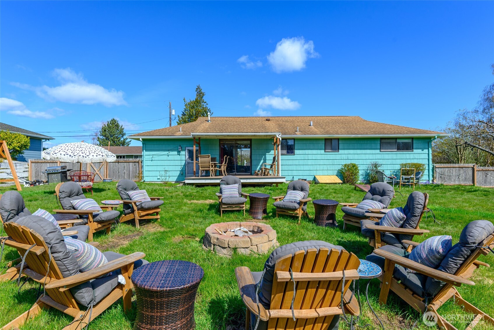 1805 37th Street Anacortes, WA 98221 - Photo 28 of 40 a view of an chairs and table in backyard