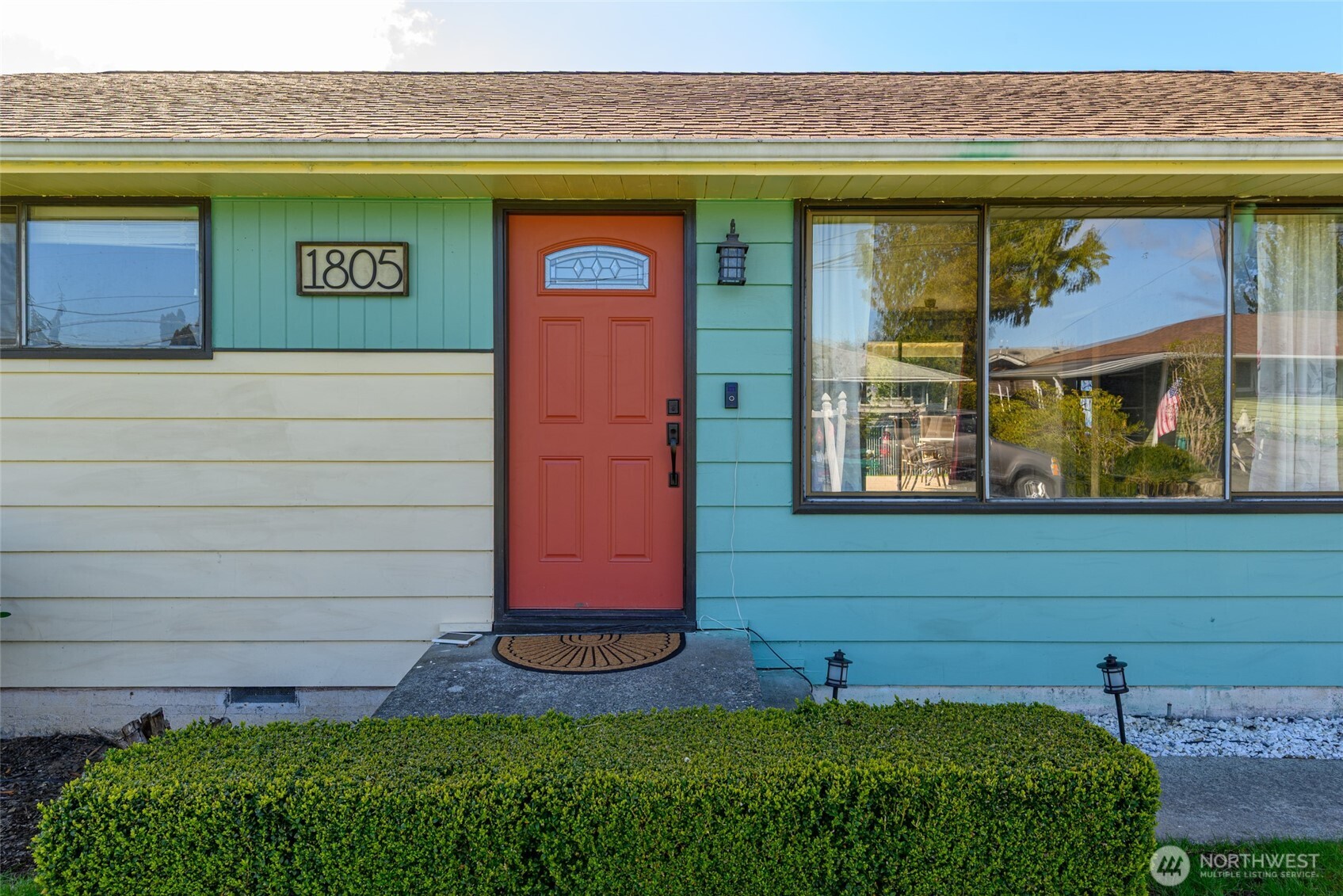 1805 37th Street Anacortes, WA 98221 - Photo 3 of 40 a front view of a house with garden