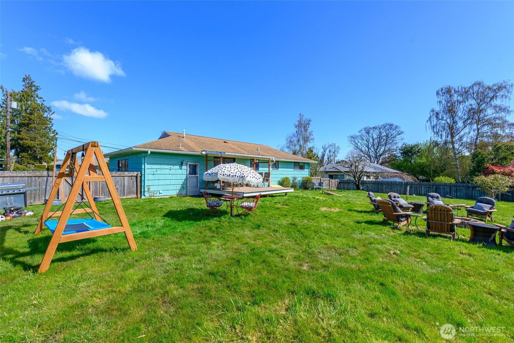 1805 37th Street Anacortes, WA 98221 - Photo 31 of 40 a view of backyard with table and chairs