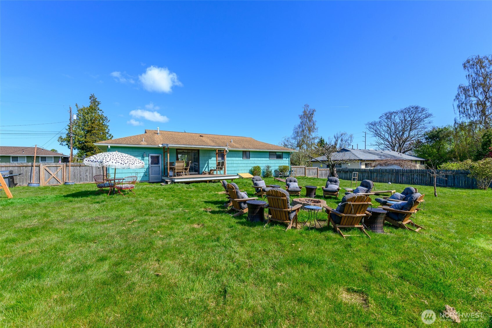 1805 37th Street Anacortes, WA 98221 - Photo 32 of 40 a view of a house with backyard sitting area and garden