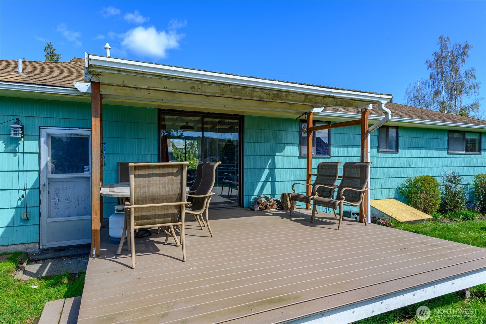1805 37th Street Anacortes, WA 98221 - Photo 37 of 40 a view of a two chairs and table in patio of the house