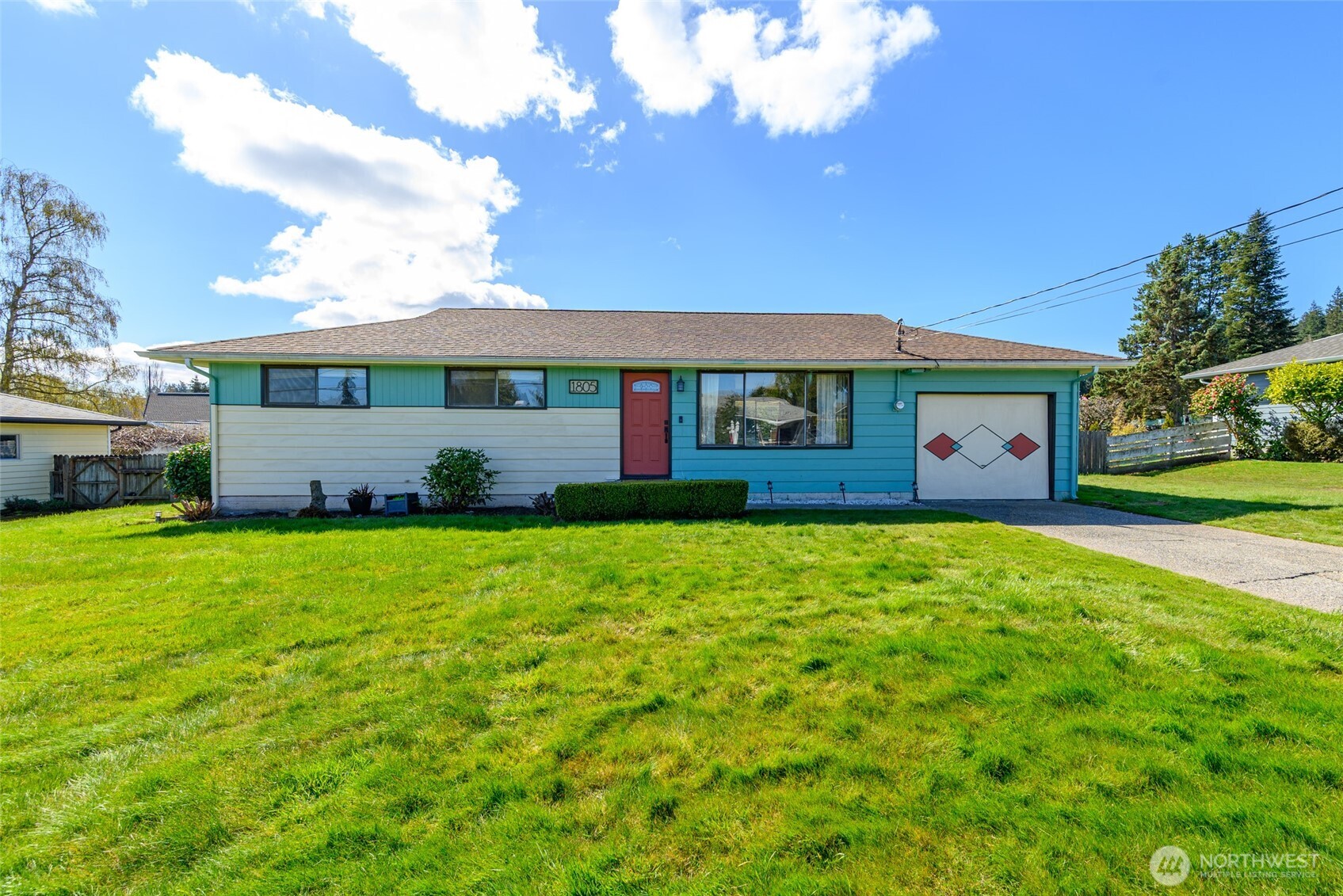 1805 37th Street Anacortes, WA 98221 - Photo 4 of 40 a front view of a house with a garden