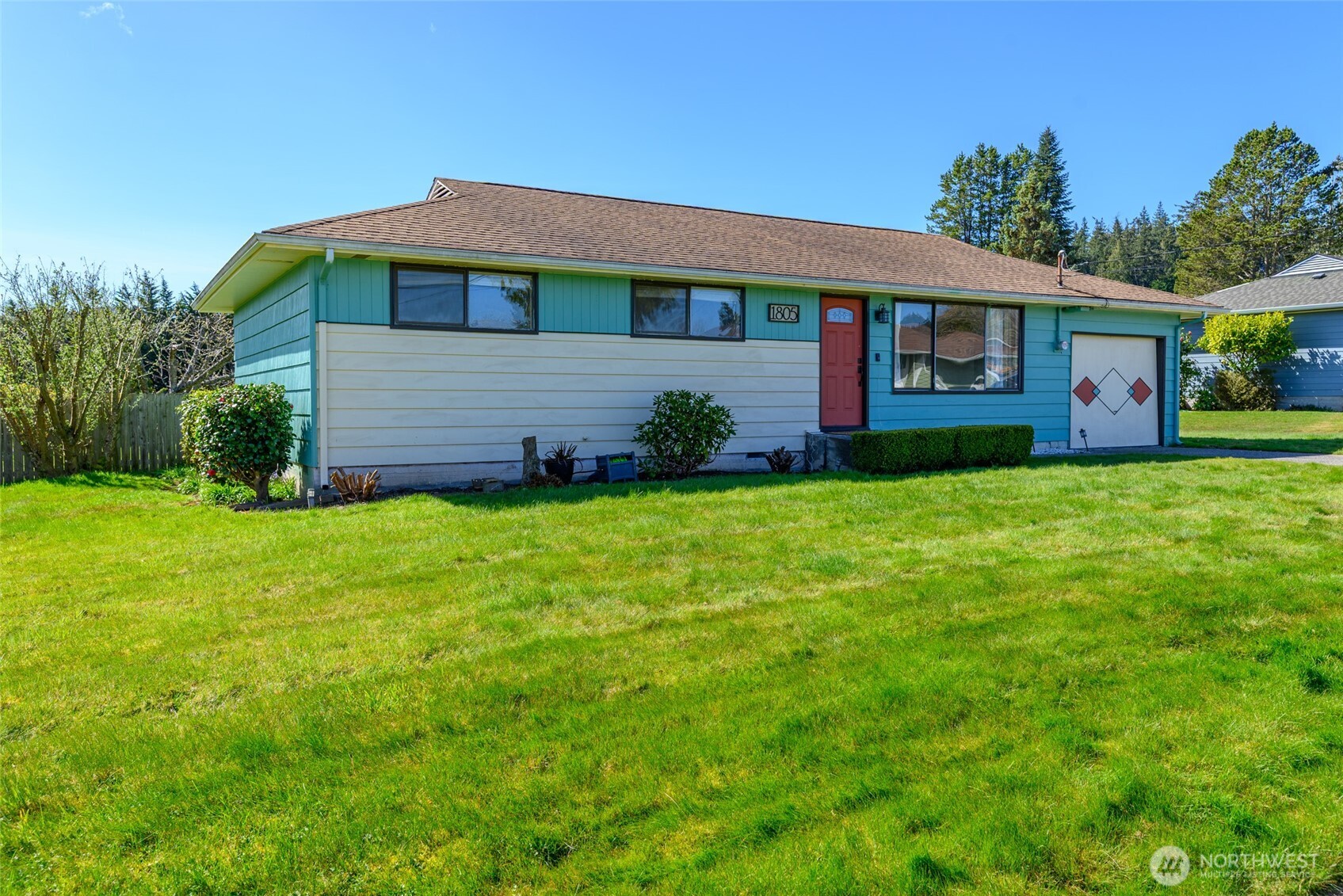 1805 37th Street Anacortes, WA 98221 - Photo 6 of 40 a front view of house with yard and green space