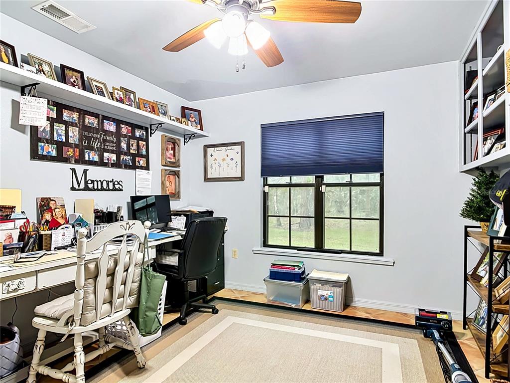 1395 Maytown Road Osteen, FL 32764 - Photo 44 of 65 a work room with furniture and a window