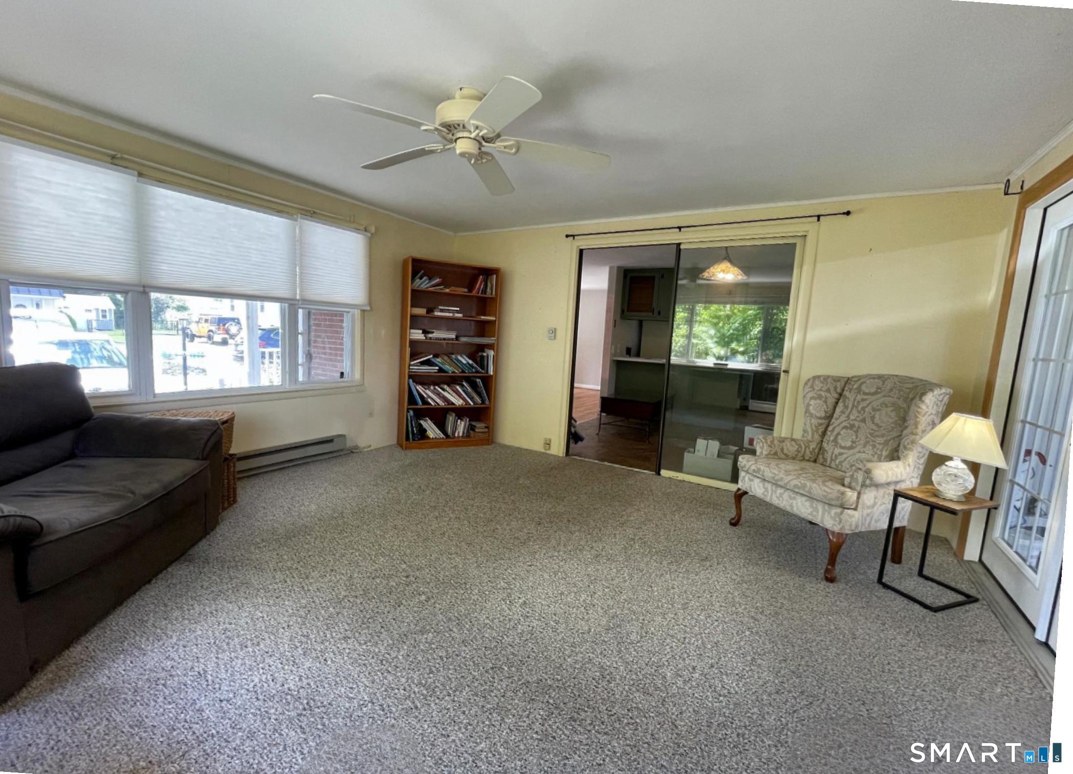 18 Old South Cove Road Old Saybrook, CT 06475 - Photo 13 of 40 a living room with furniture and a large window