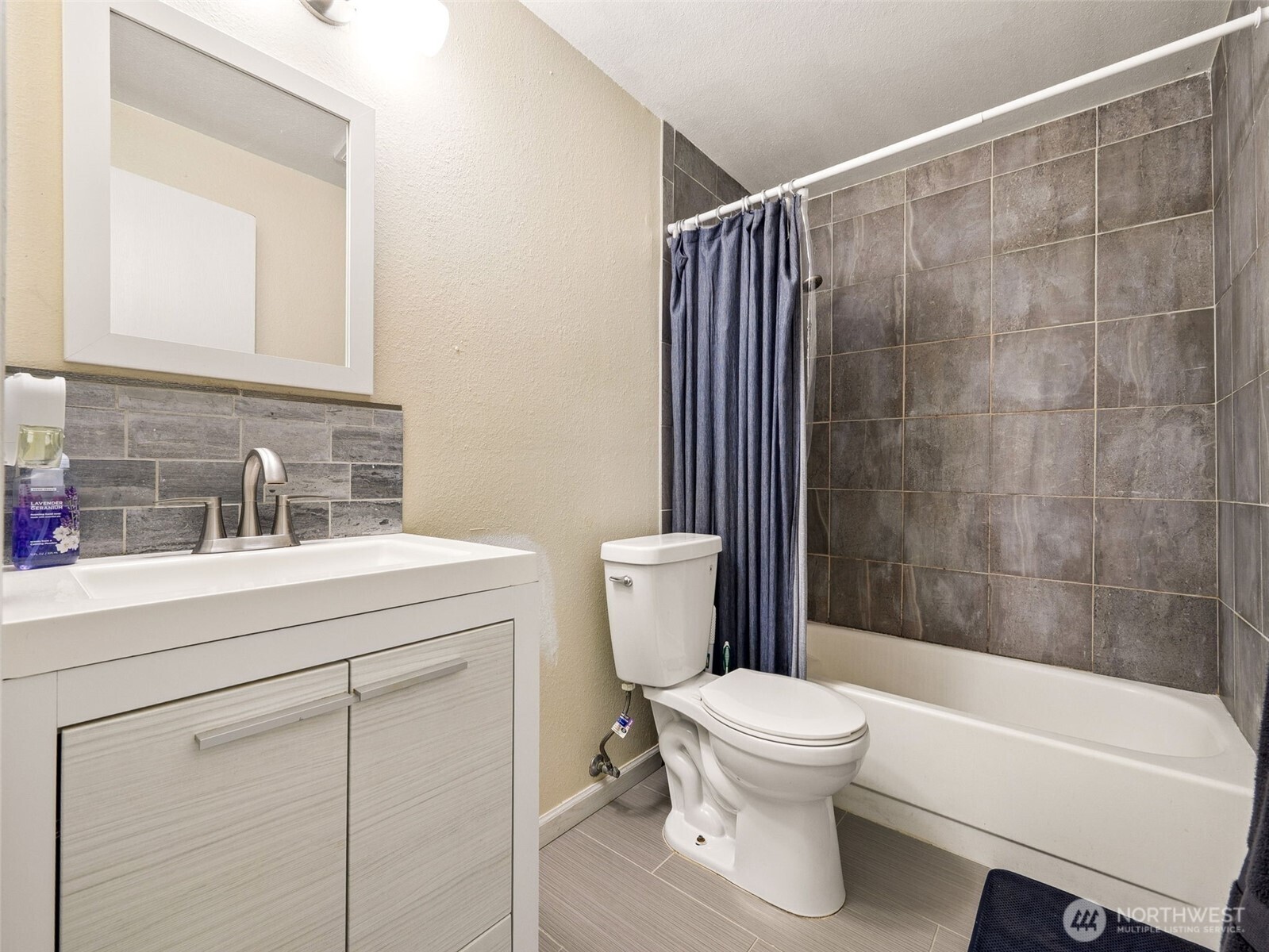 4601 Southwest 320th Street, Unit R2 Federal Way, WA 98023 - Photo 7 of 10 a bathroom with a sink toilet and shower