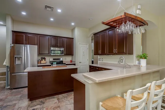 a spacious bedroom with a bed and a large window