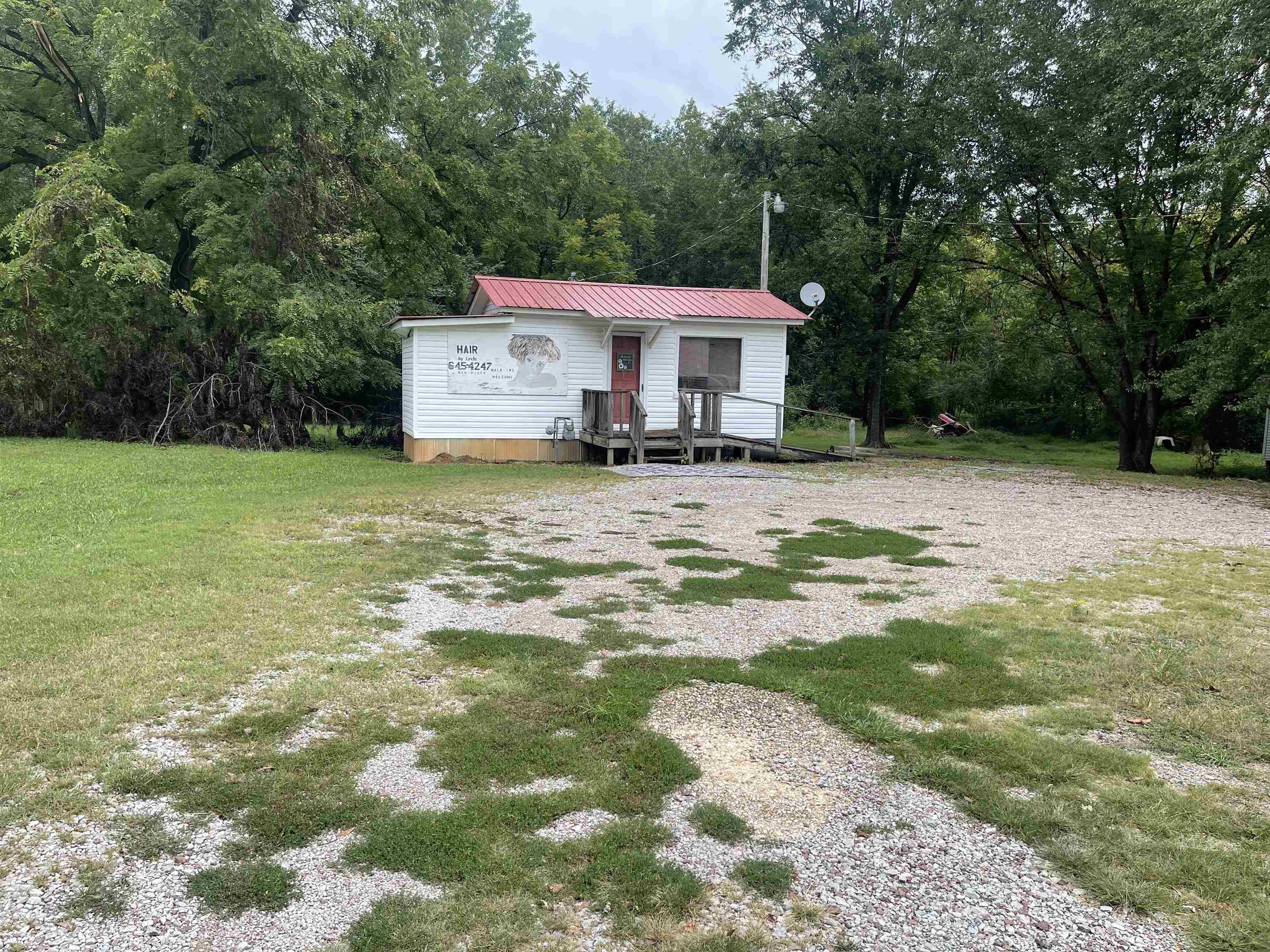 213 Adams Selmer, TN 38375 - Photo 16 of 16 a view of a house with a yard