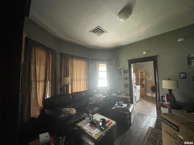 a kitchen with a refrigerator and cabinets