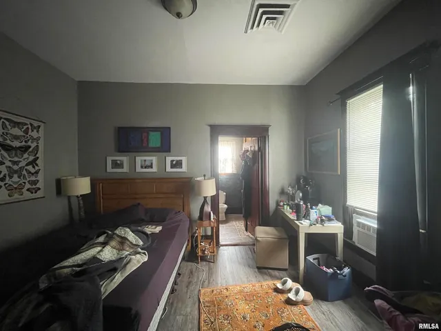 a room with furniture and large windows