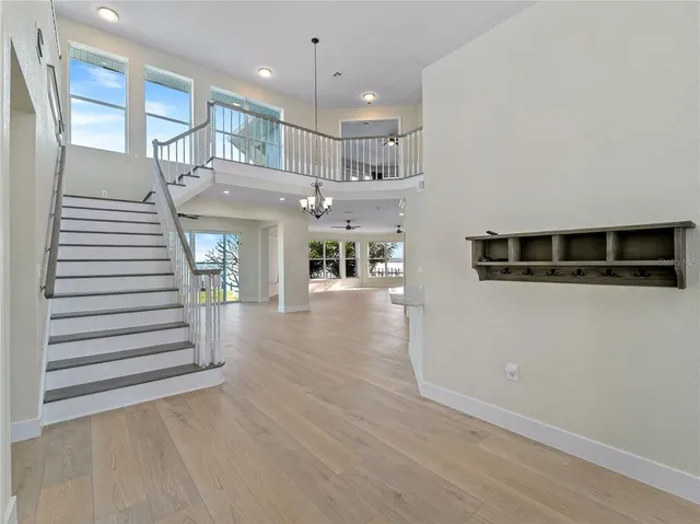 a kitchen with stainless steel appliances granite countertop a sink a refrigerator and a granite counter tops