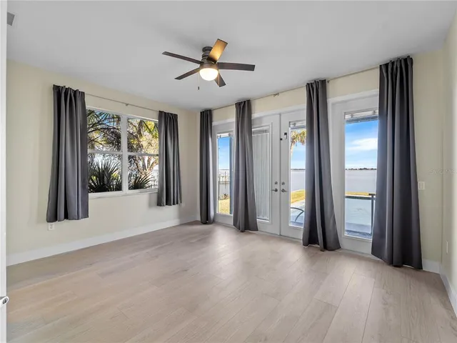 a view of a room with wooden floor