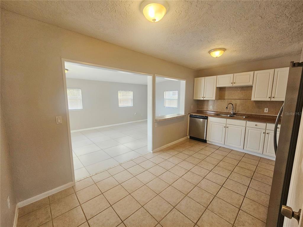 7000 Brentford Road Sarasota, FL 34241 - Photo 6 of 29 a kitchen with stainless steel appliances granite countertop a sink and cabinets