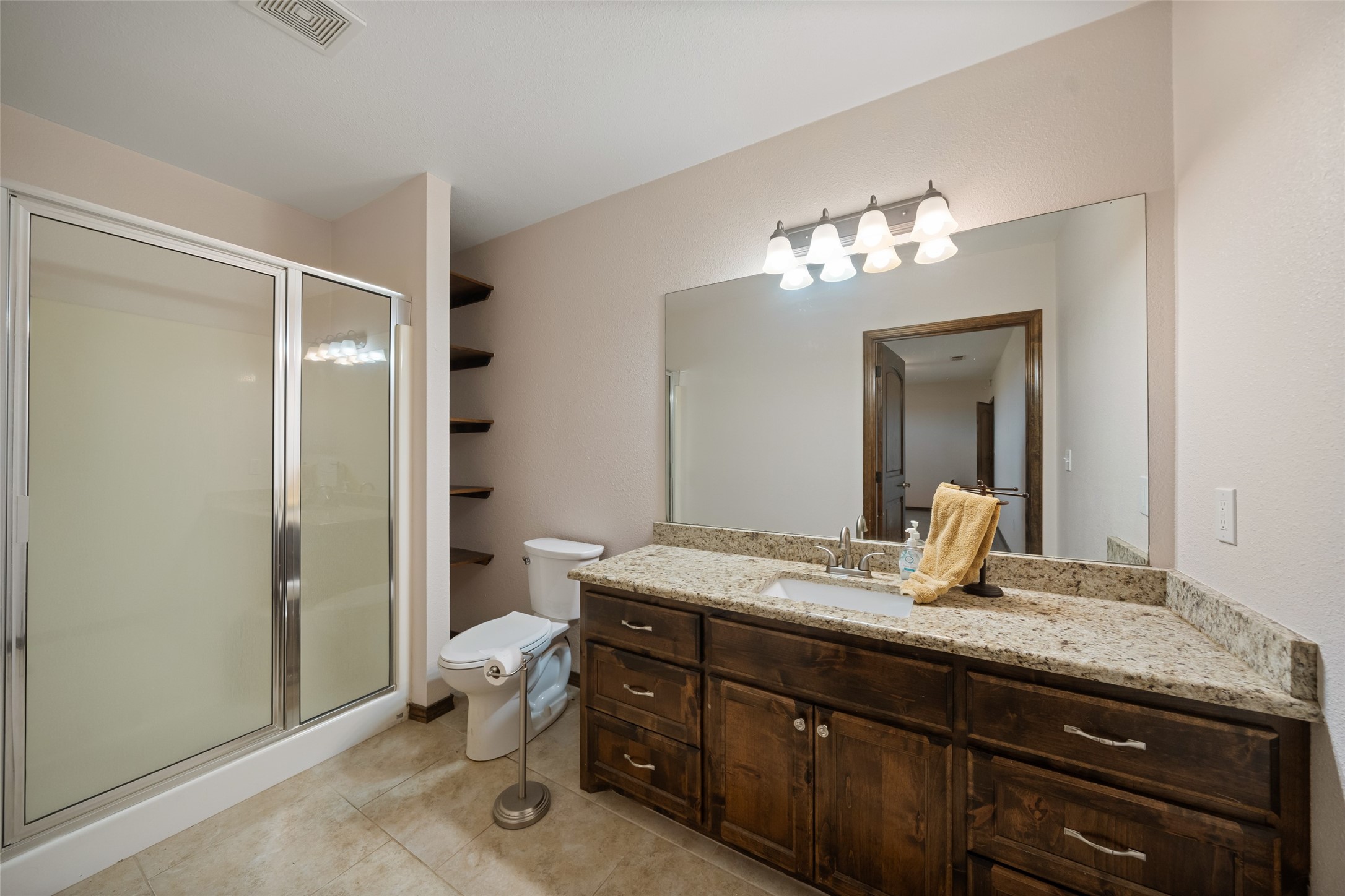 119 Fm 1891 Shiner, TX 77984 - Photo 29 of 40 a bathroom with a granite countertop sink and a mirror