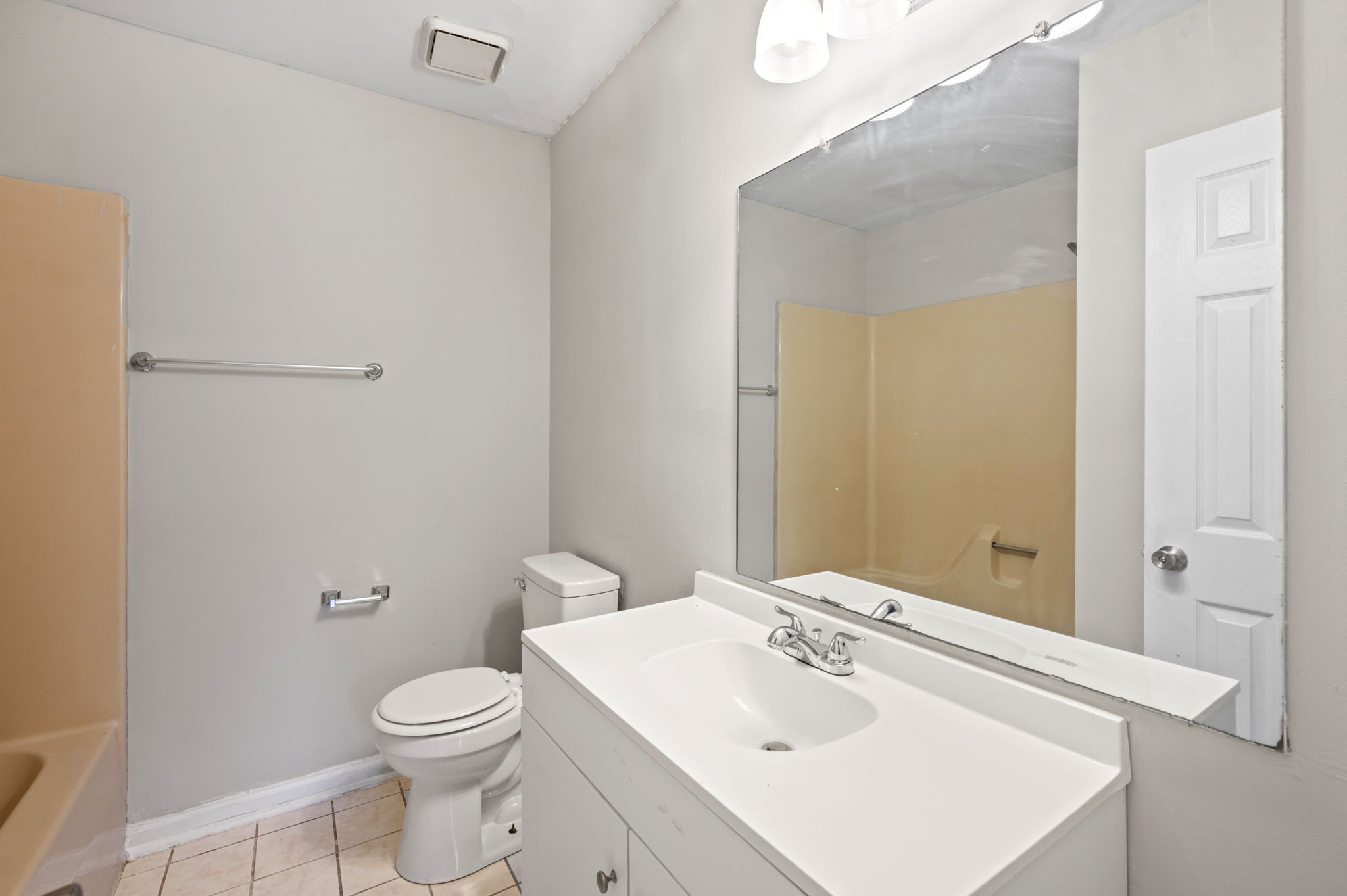 101 Walnut Street, Unit 19 Clarksville, TN 37042 - Photo 11 of 12 a bathroom with a sink mirror and toilet