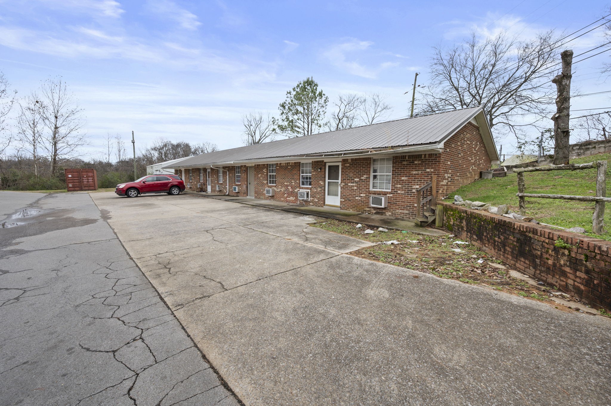 101 Walnut Street, Unit 19 Clarksville, TN 37042 - Photo 3 of 12 a view of a house with a yard and potted plants