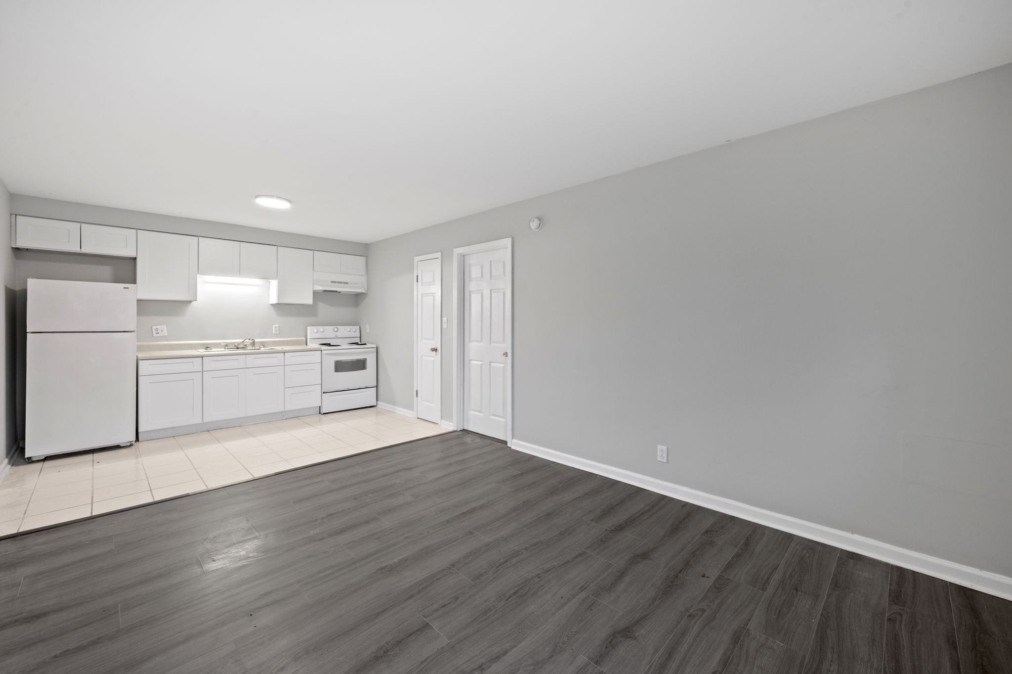 101 Walnut Street, Unit 19 Clarksville, TN 37042 - Photo 4 of 12 a view of a kitchen with a sink and a refrigerator