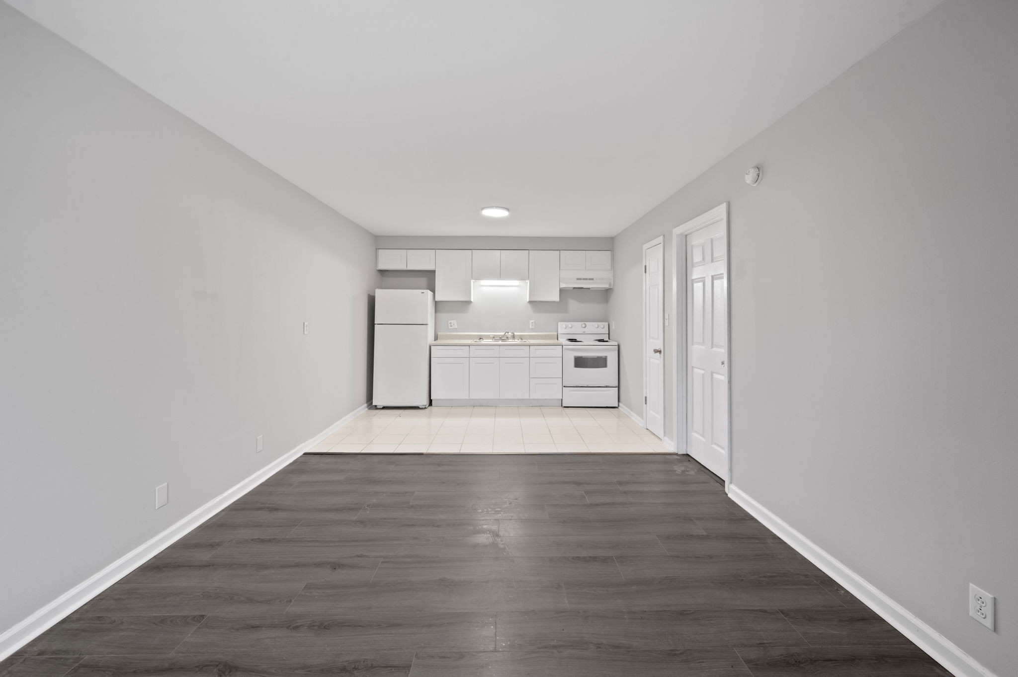 101 Walnut Street, Unit 19 Clarksville, TN 37042 - Photo 5 of 12 a view of empty room with wooden floor
