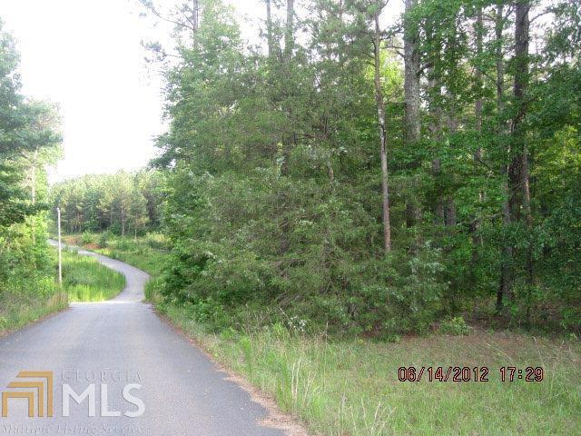 2074 Whippoorwill Road Bishop, GA 30621 - Photo 1 of 1 a view of a street with a trees in front of it