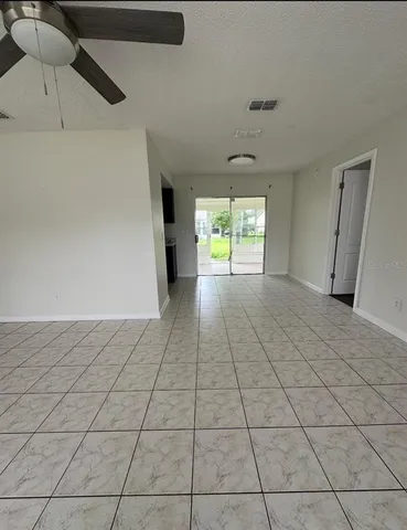 a view of an empty room and window