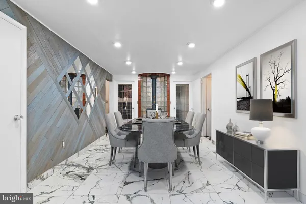 a view of a dining room with furniture and window