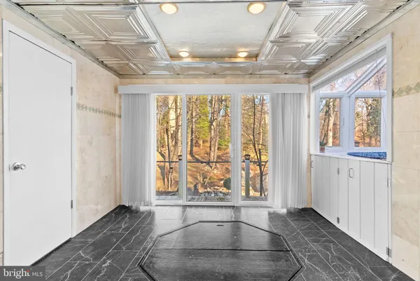 a view of entryway with a front door
