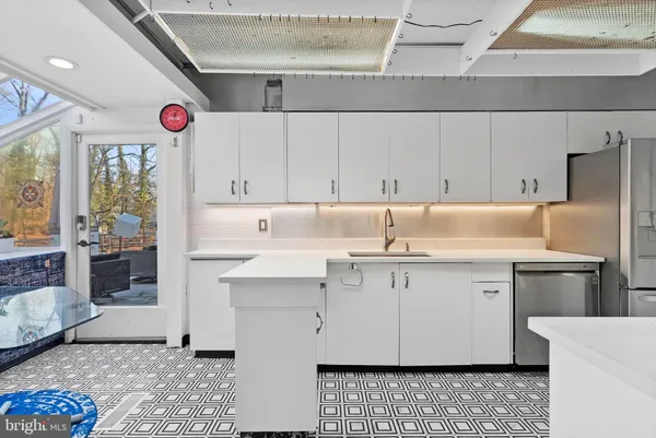 a kitchen with lots of counter top space and appliances