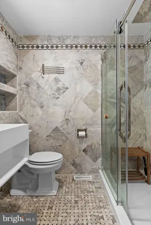 a view of a bedroom with washer and dryer