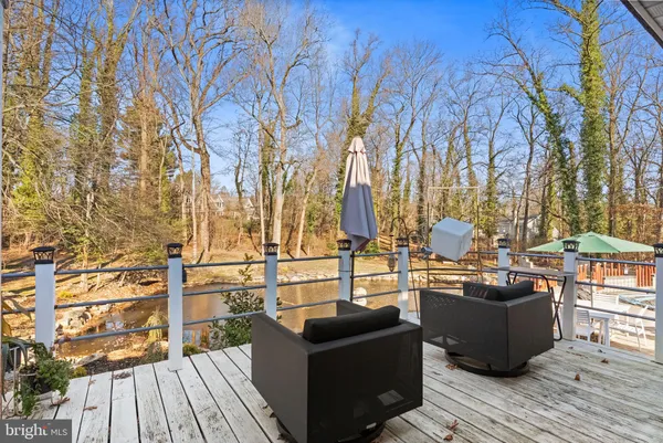 a view of yard with swimming pool and outdoor seating