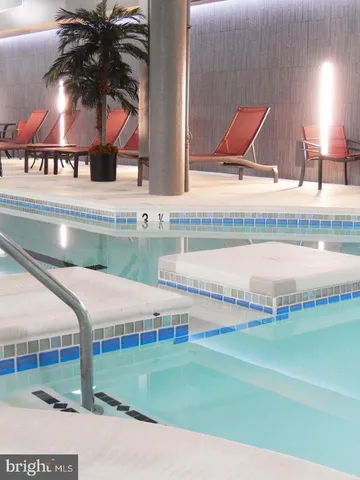 a view of a patio with a dining table and chairs