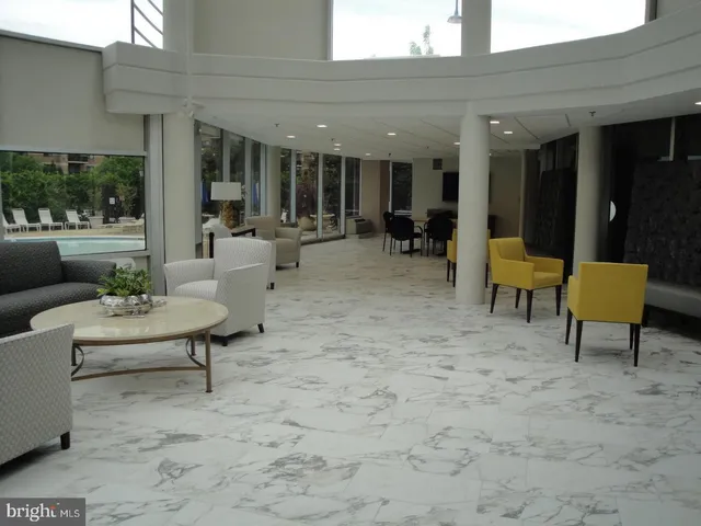 a room with furniture pool table and outdoor view