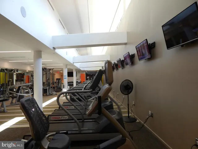 a view of a livingroom with furniture and staircase