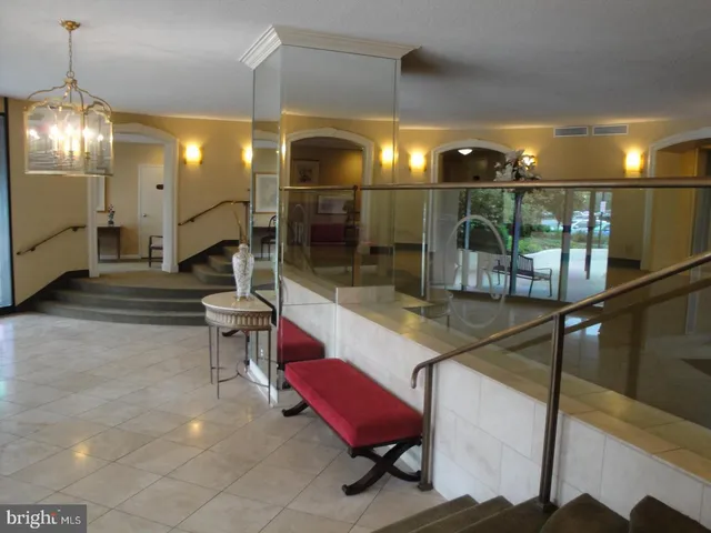 a kitchen with a stove and a flat screen tv