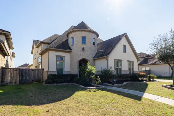 a front view of house with yard and green space