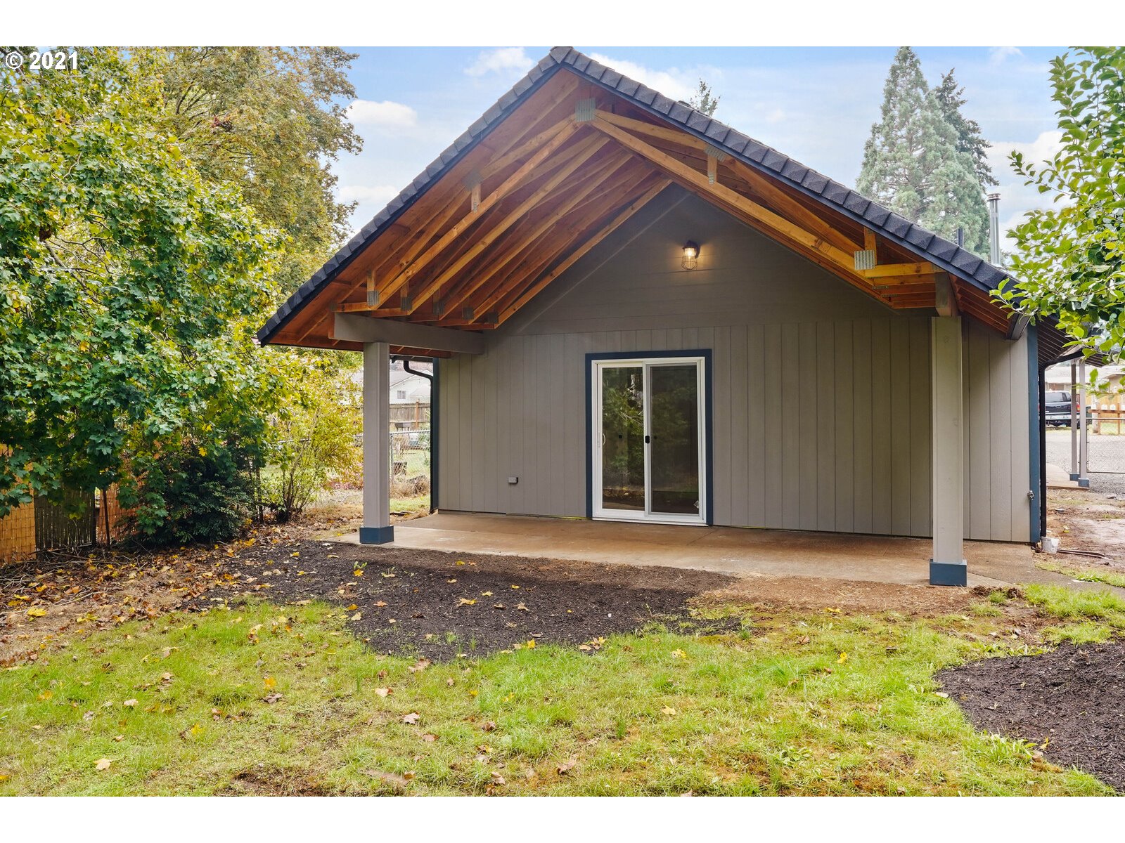 195 Mize Road Southeast Salem, OR 97302 - Photo 12 of 12 a backyard of a house with large trees and a small barn