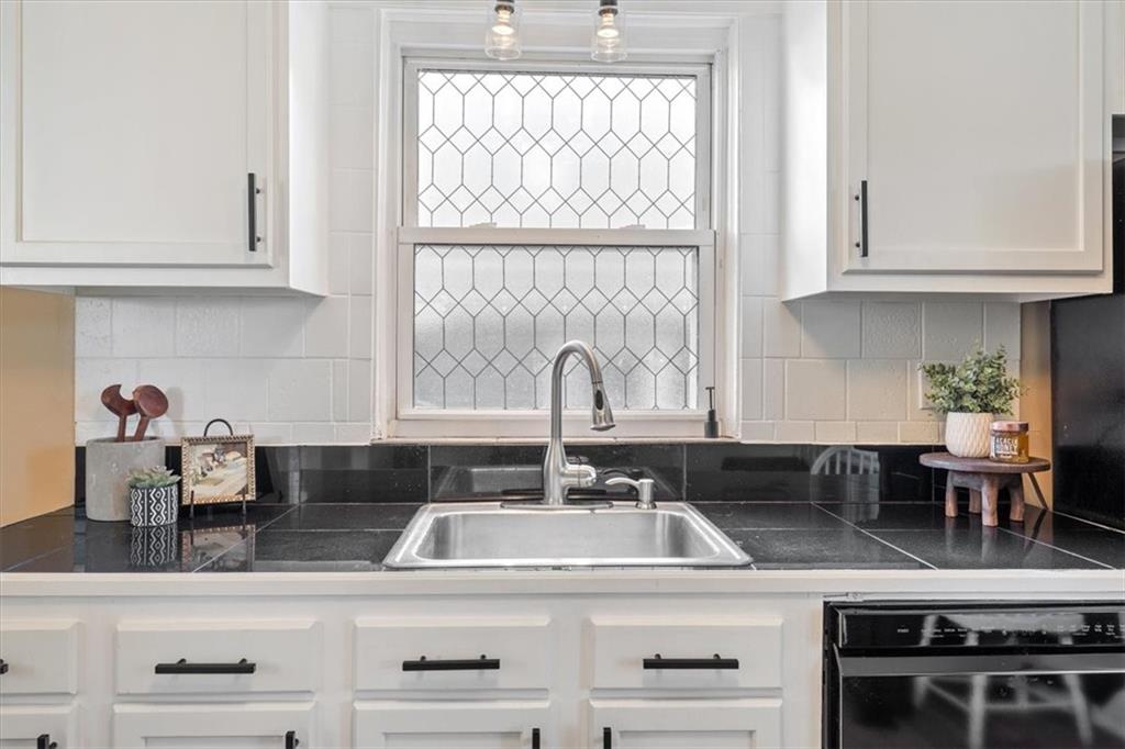 831 Malvern Road Pittsburgh, PA 15202 - Photo 12 of 33 a kitchen with stainless steel appliances granite countertop a sink and a white wooden cabinets