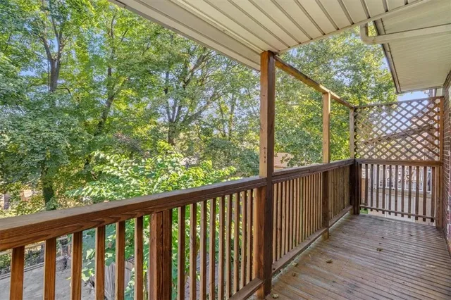 a view of balcony with wooden floor
