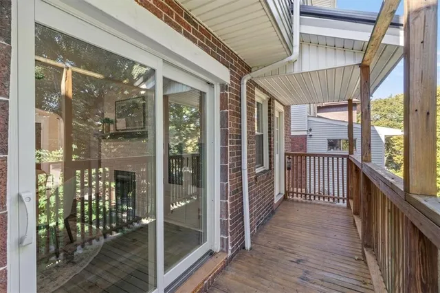 a view of a porch with wooden floor