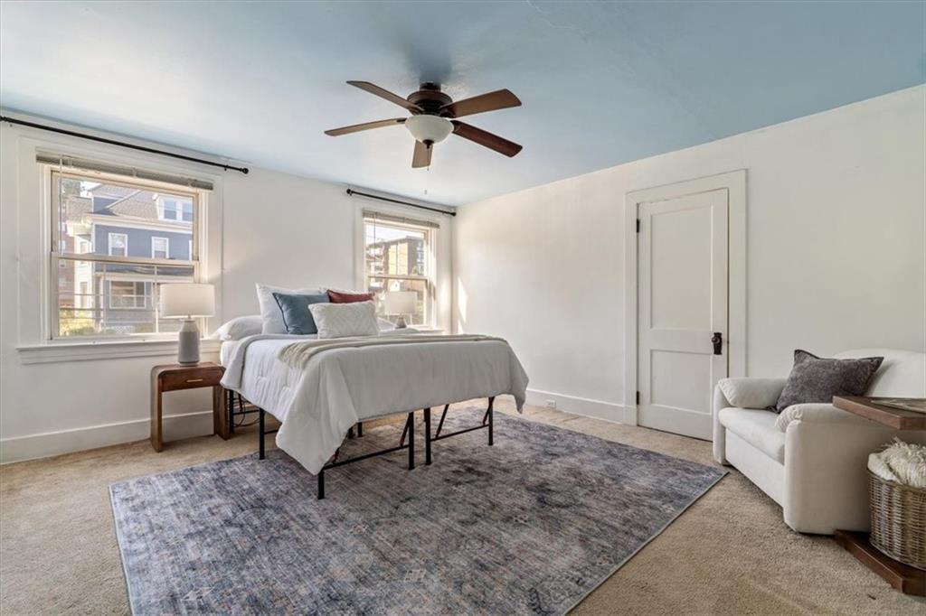 831 Malvern Road Pittsburgh, PA 15202 - Photo 20 of 33 a bedroom with a bed and ceiling fan