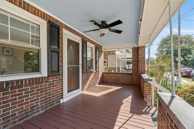 a view of a balcony with wooden floor